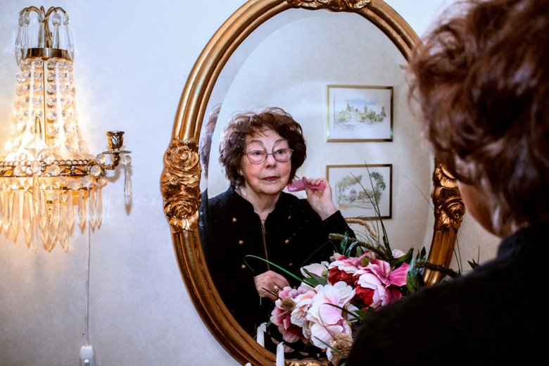 Elderly person at mirror
