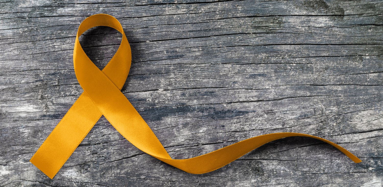 Guldbandet mot barncancer.
