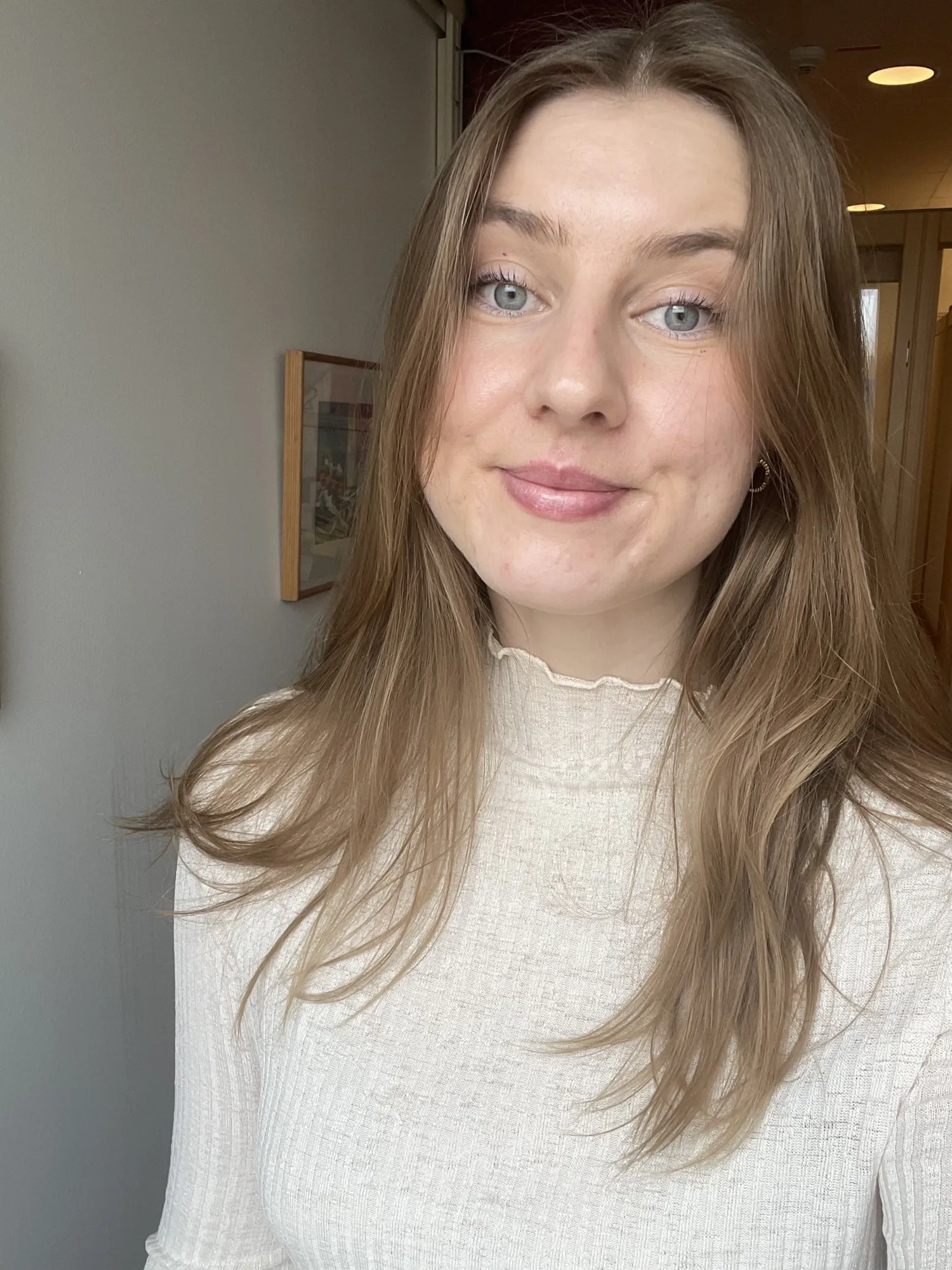 Porträtt av en kvinna.