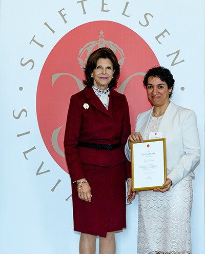 Graduation ceremony for Silvia Physicians. Niran el Kuoni receives her diploma from H M Queen Silvia Bernadotte.