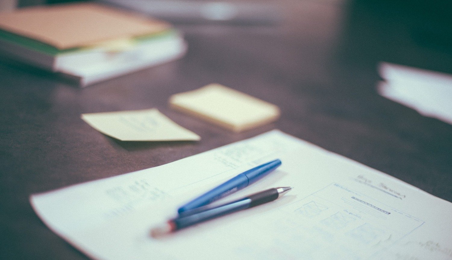 Paper and hand with pen