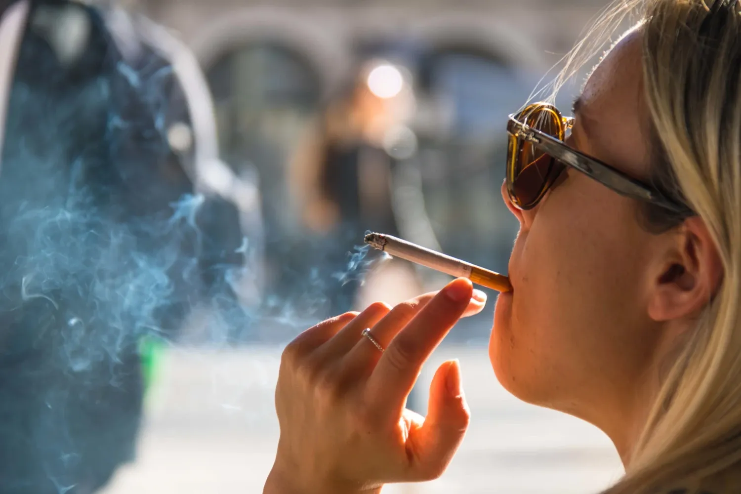 Woman smoking a cigarette.