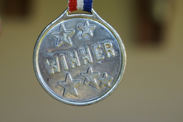 Medalj med texten WINNER