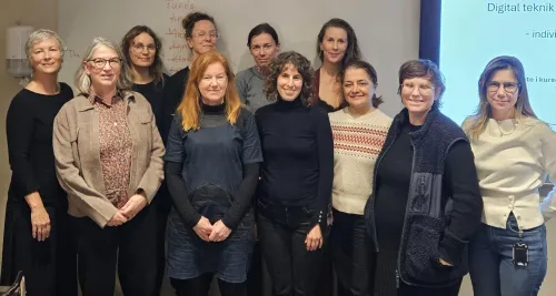 A group of teachers in a classroom.