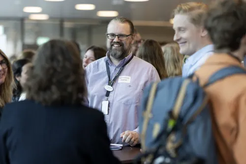 People in conversation during an event.