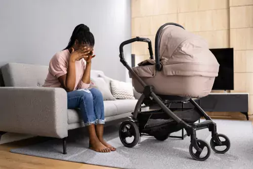 Mother with perinatal depression and pram.