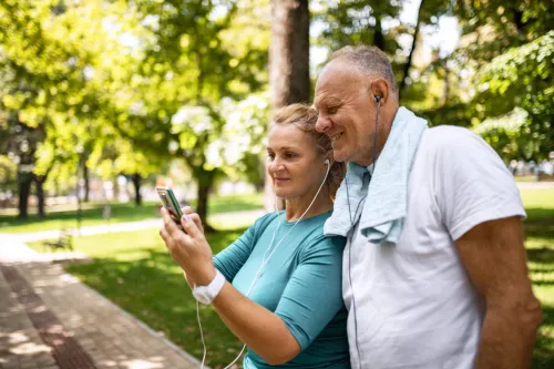 Woman and man looking at phone
