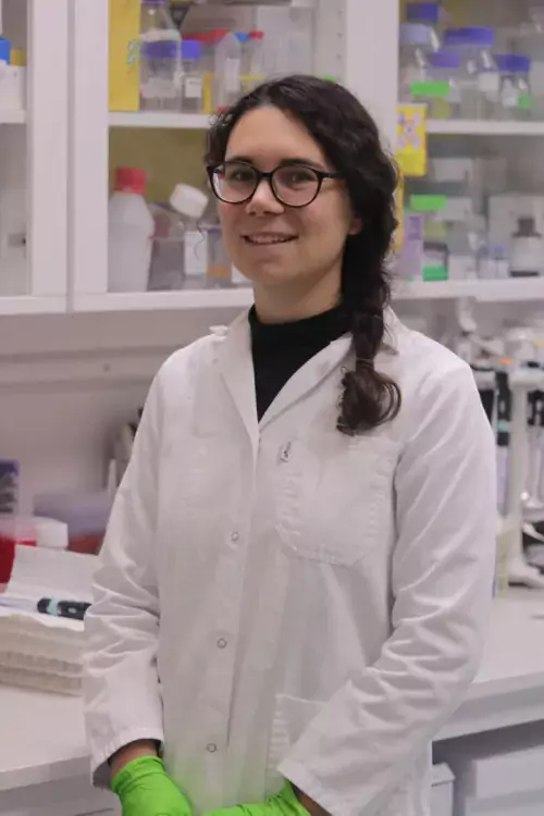Giovanna Perinetti Casoni, in a lab wearing a white coat