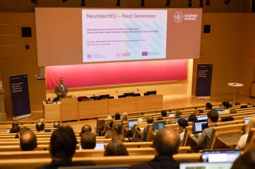 Presenter addressing an audience at the NeurotechEU Innovation Summit.