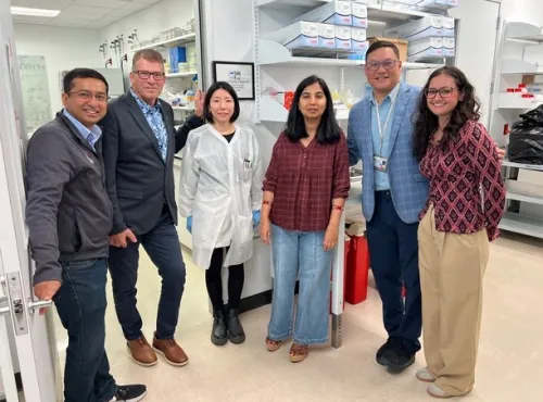 Six persons in a laboratory