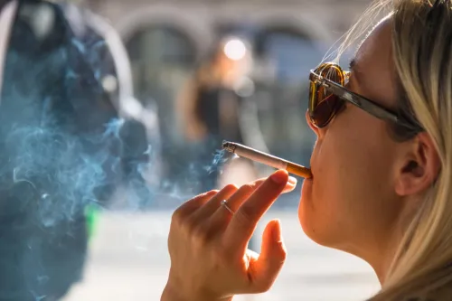 Woman smoking a cigarette.